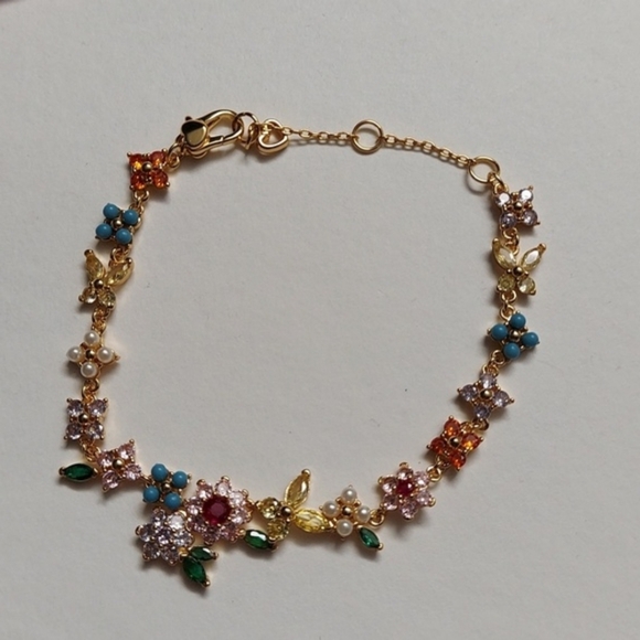 Kate Spade Gold Bracelet with Multicolor Floral Charms - Picture 5 of 7